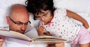father and daughter reading